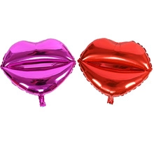 Detailed view of red and rose red kiss lip-shaped foil balloons with metallic shine