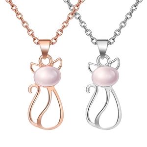 Rose gold and silver cat pendants with pink crystal stones on minimalist necklaces