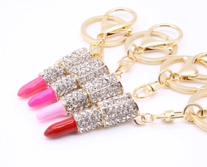 Lipstick keychains in pink and red with golden finish and sparkling rhinestones