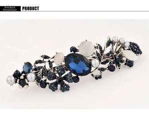 Detailed view of vintage blue gem hair clip with pearls and antique silver finish