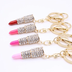 Sparkling crystal lipstick keychains in four colors with gold-tone hardware and rings