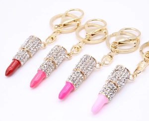 Sparkling lipstick keychains with silver rhinestones and gold hardware in four shades