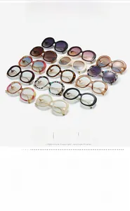 Assorted UV400 fashion sunglasses in black, tortoise, and floral patterns set on white