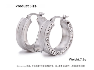 Detail view of 8.2mm wide stainless steel hoop earrings with side pavé zircon setting