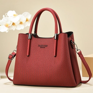 Red striped leather handbag with Fashion Queen logo and adjustable shoulder strap