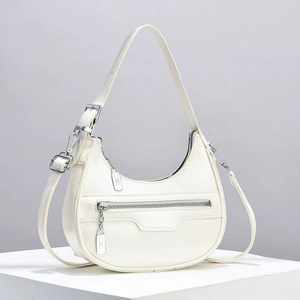 Chic cream white half-moon shoulder bag with sleek silver hardware and modern design
