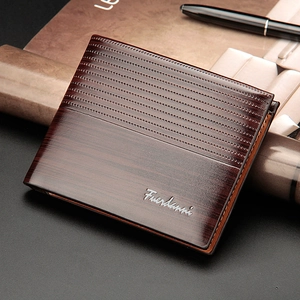 Detailed view of dark brown textured men's wallet with embossed stripes and leather finish