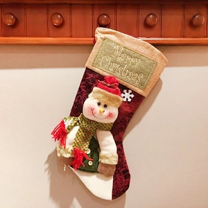 Hanging Christmas stocking featuring a 3D snowman doll and Merry Christmas patch