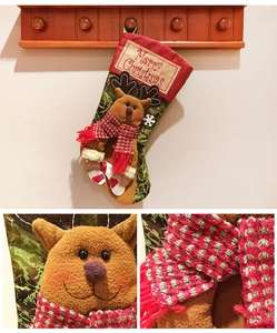 Detail of Christmas stocking with 3D reindeer design and embroidered Merry Christmas text