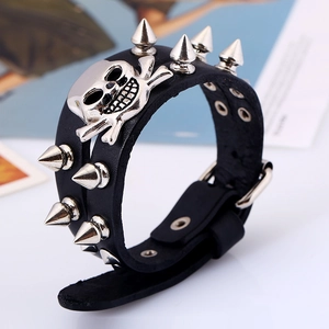 Punk rock leather bracelet with silver skull charms and metallic spikes for men and women