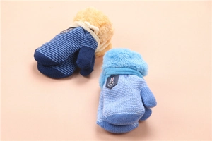 Detail of blue striped knitted winter gloves for kids with thick plush cuff lining