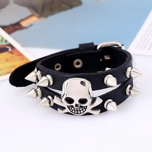 Punk rock black leather bracelet with silver skull charms and spiked metal rivets