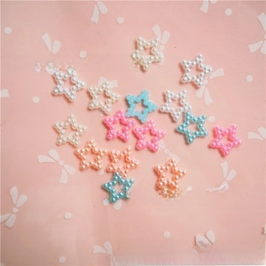 Macro detail of colorful star-shaped pearl patches for DIY craft jewelry and accessories