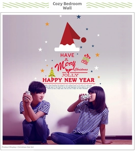 Detail of waterproof Christmas hat wall stickers with Merry Christmas greeting on bedroom wall