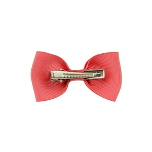 Pink grosgrain ribbon bow hair clip with silver metal alligator clamp on white background