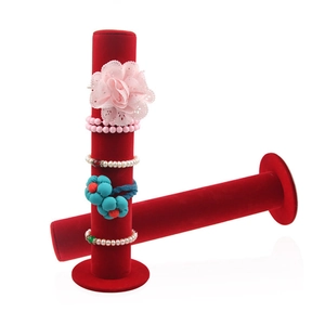 Vertical red velvet scrunchie and jewelry display stand set with cylindrical base