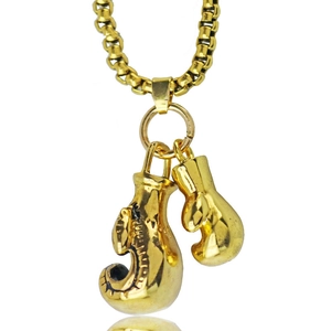 Close-up of golden stainless steel double boxing glove pendants on a matching box chain