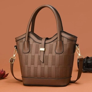 Elegant dark brown woven leather tote bag with gold hardware and crossbody strap