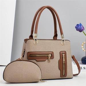 Women's two-piece brown woven tote bag with crossbody strap and sunflower hardware