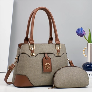 Elegant canvas tote and pouch set with brown leather trim and golden K pendant