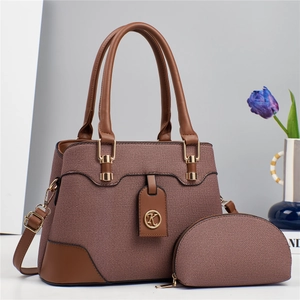 Elegant brown textured two-piece handbag set with gold hardware and logo charm