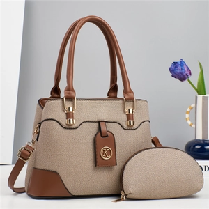 Detail of two-piece brown twill tote bag with matching pouch and golden K logo
