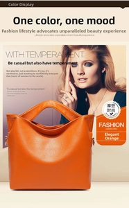 Detailed view of orange lychee grain leather tote bag with unique circular hollow handle