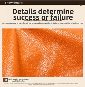 Close-up of premium orange lychee grain leather showing the delicate texture of the handbag