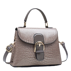 Elegant taupe crocodile pattern top-handle handbag with gold metal clasp for women