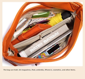Top view of the orange lychee grain leather bag interior showing spacious compartments