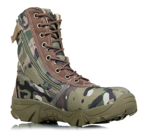 Close-up of tactical camo boots featuring side zipper and durable rubber outsole