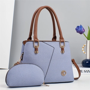 Blue denim texture tote bag with brown leather handles and matching small pouch
