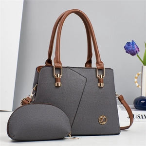Gray textured tote and brown faux leather handle with gold K logo charm for women
