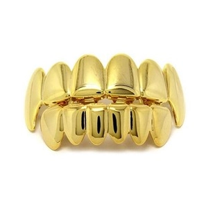 Detail of hip hop style gold plated double row grills for teeth with high shine finish