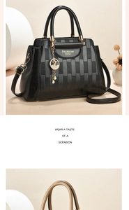 Close-up of woven texture and golden FASHION Queen logo on black bucket handbag