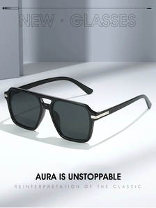 Detail of square black sunglasses with iconic double bridge and silver metal hinges