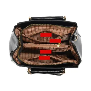 Detailed view of bucket bag interior compartments with large capacity for daily items