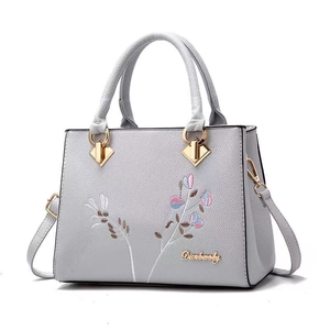 Chic light gray pebbled leather crossbody bag for women with floral embroidery design