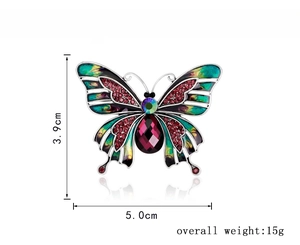 Detailed view of enamel butterfly brooch with dimensions 5.0cm width and 3.9cm height