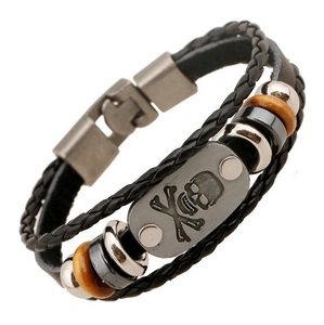 Men's multi-layer black braided leather bracelet with skull metal charm on white background