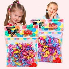 Detail of high-elastic multi-colored polyutherane hair bands in large clear packaging