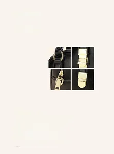 Close-up of litchi grain black leather texture and premium gold-toned metal hardware