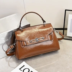 Brown oil-wax leather trapezoid handbag with silver buckle and detachable shoulder strap