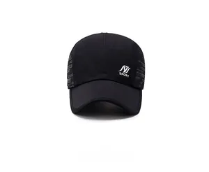 Close-up of black baseball cap featuring white SPORT print and textured side stitching