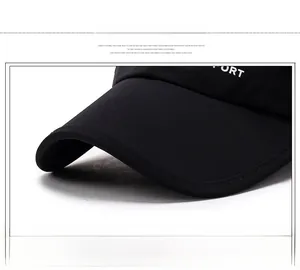 Close-up of black baseball cap brim showing reinforced stitching and twill fabric texture