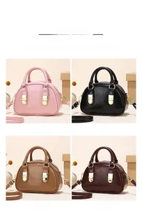 Four different colors of vintage bowling handbags with metal zippers and leather straps