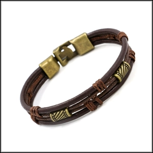 Macro shot of brown braided leather strands with antique bronze metal buckle for men