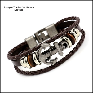 Detail of vintage anchor charm leather bracelet with multilayered brown braided rope cords