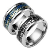 Macro detail of stainless steel rings with World of Warcraft engraving and colorful inlay
