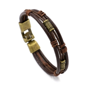 Men's multilayer brown braided leather bracelet with vintage brass beads on white background